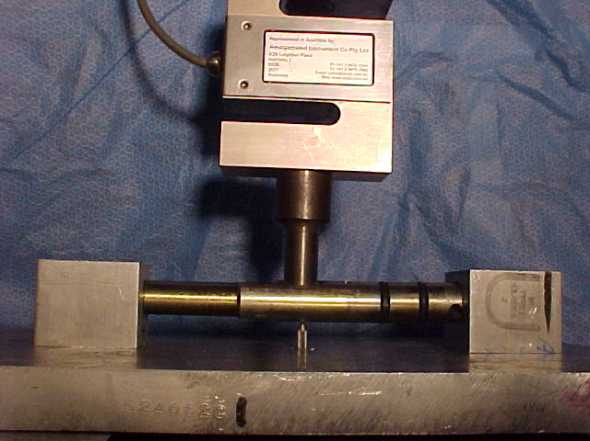 Testing of valve shaft for deflection under a bending load. The results were used to compare 4140 in the normalised and heat treated conditions.